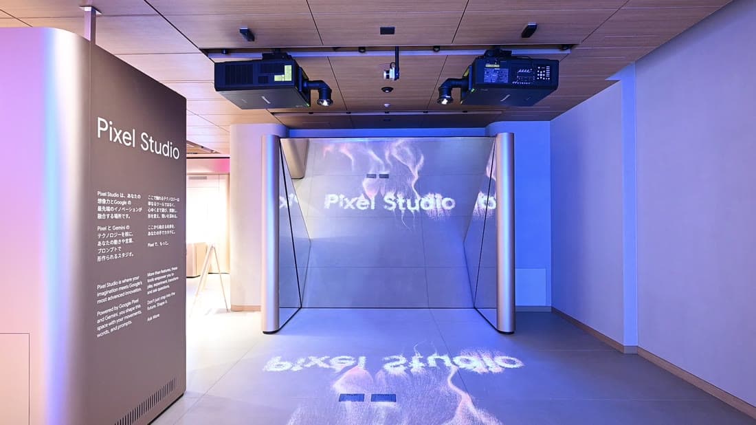 The installed corridor with the Pixel Studio wordmark projected on the floor and back wall