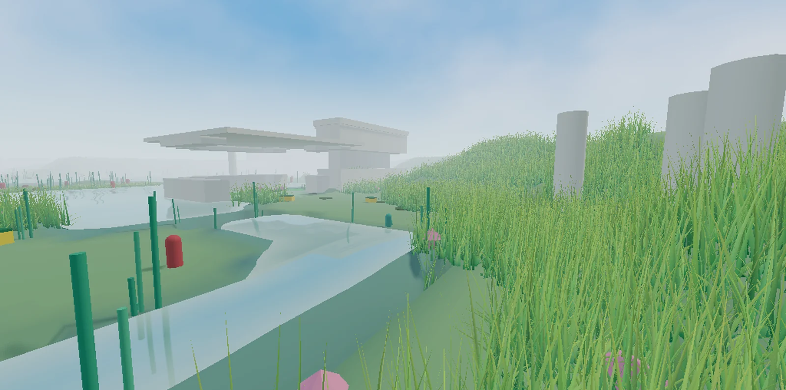 The prototype's view of a water channel between grass banks, with white architecture in the distance