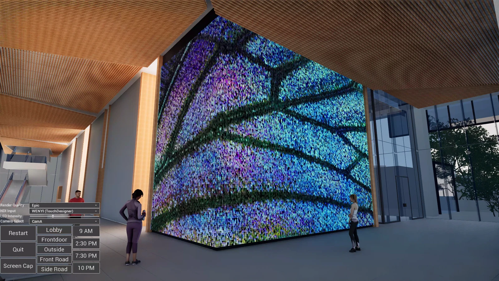 Unreal view of a building lobby with a large LED wall running blue and green generative content, two figures for scale, and a control panel in the corner